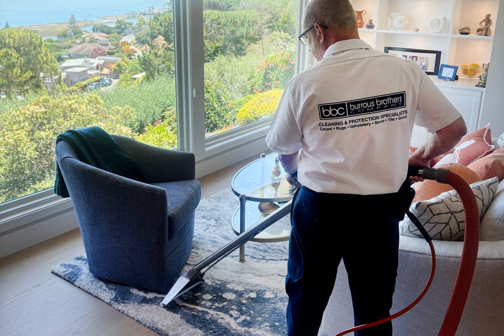 Burrous Brothers Company technician cleaning a wool area rug on location in a Marin County home