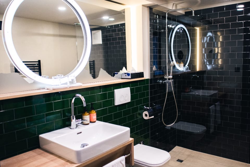 Tiled shower and bathroom with visible grout lines