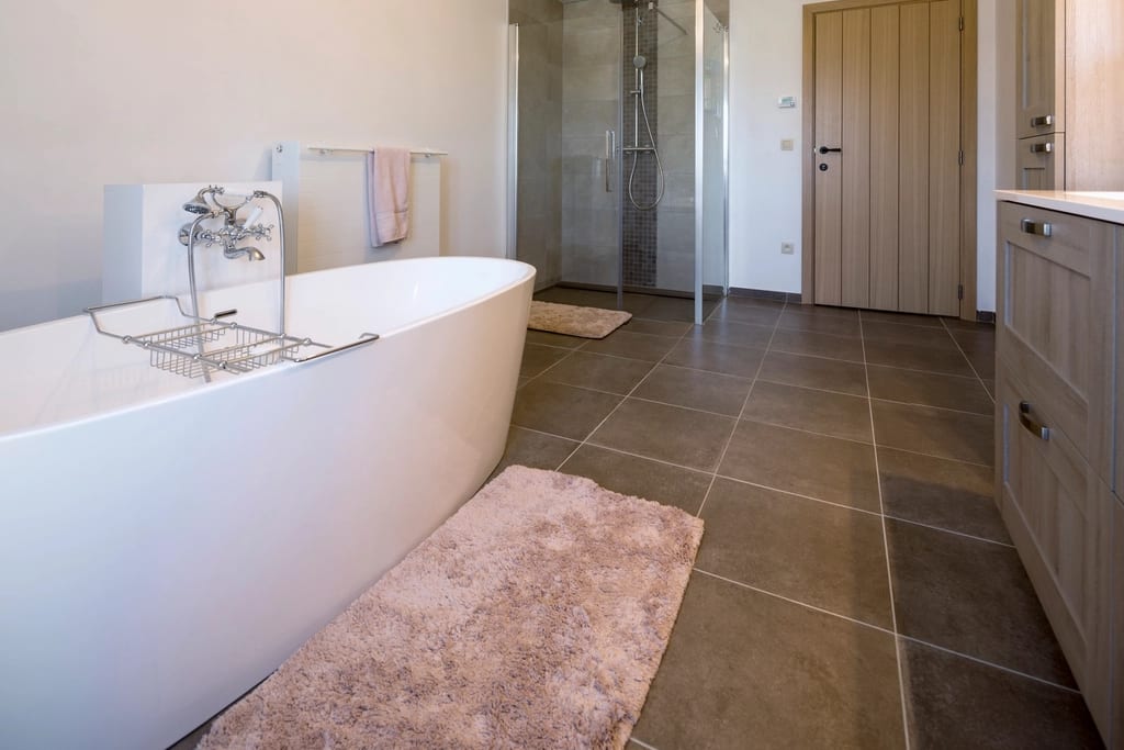 Large-format tile floor with sealed grout joints
