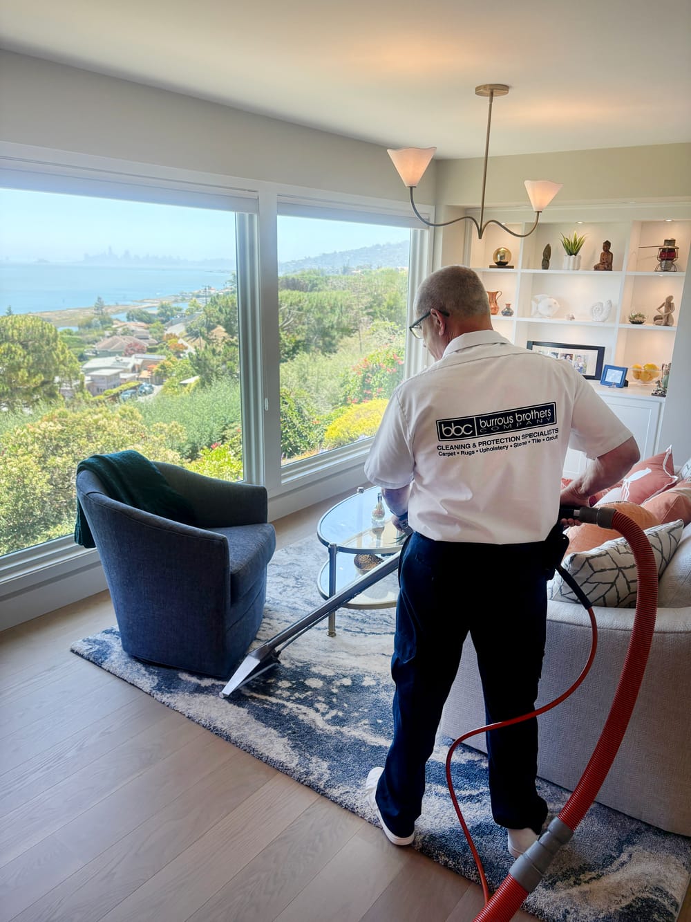 Burrous Brothers Company technician deep-cleaning an area rug in a Marin County home