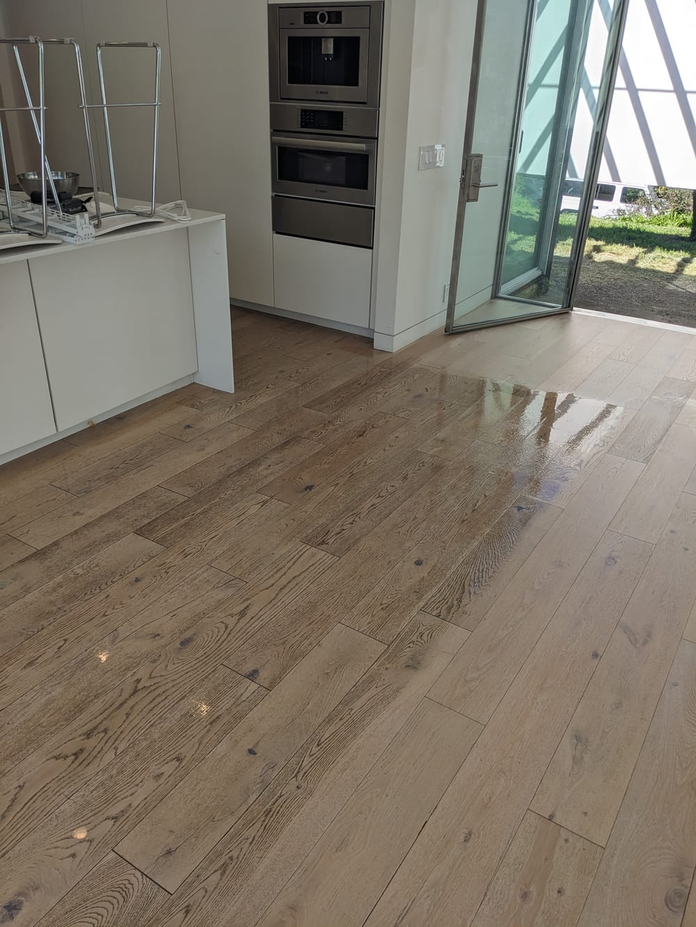 Restored, glossy hardwood floor after cleaning in a Marin County home